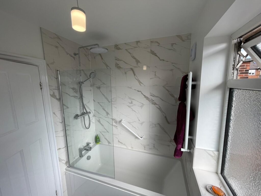 Electric shower and bath installed in new bathroom in Leeds by Norton Plumbing