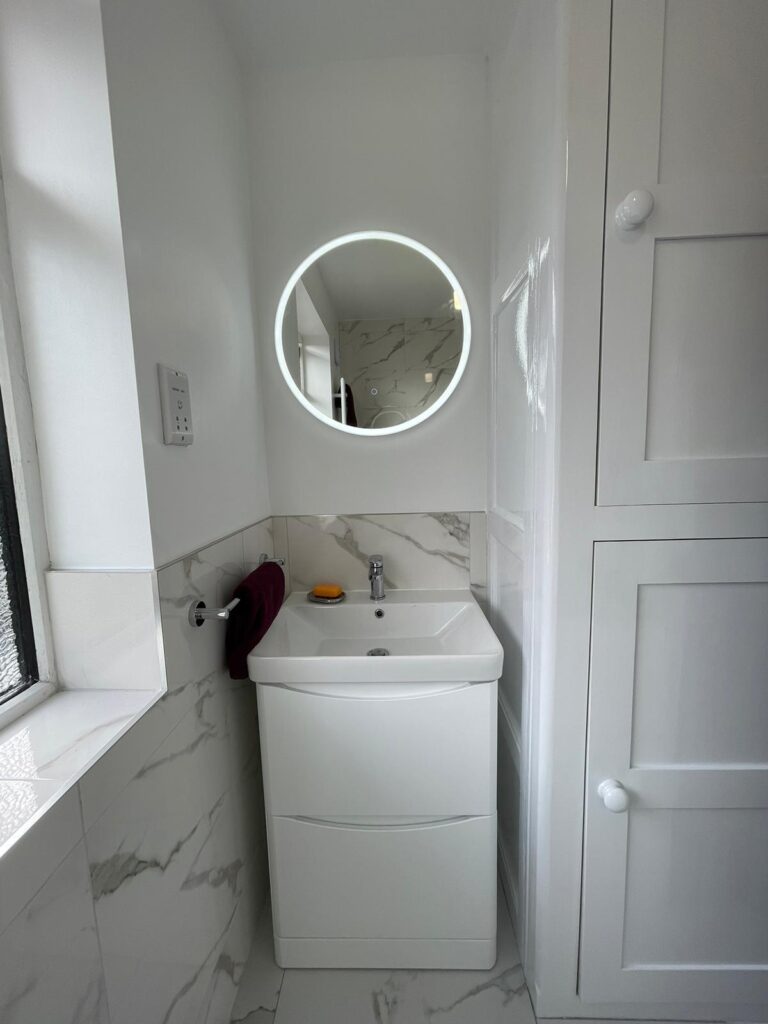 Heated LED anti fog mirror installed in bathroom installation In Leeds